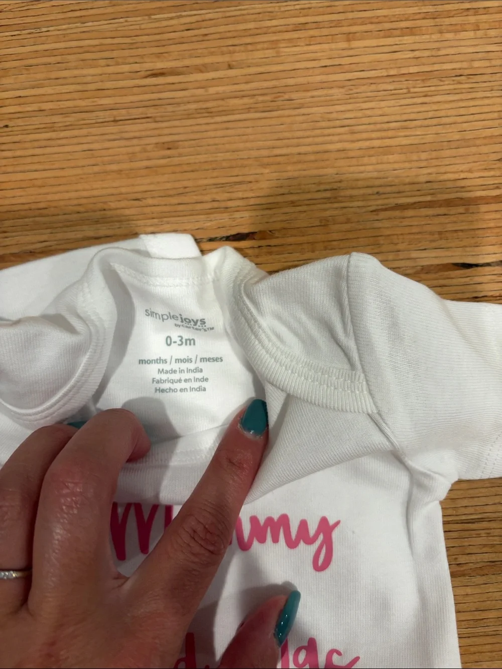 Simple White One-Piece with Pink Script Saying 